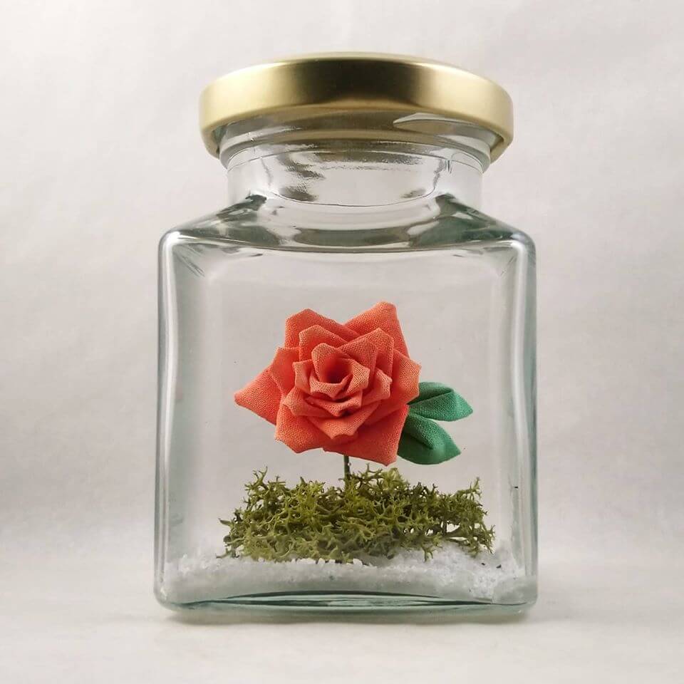Just to let you know that we are still trading as usual but shipment may be delayed.  We have redecorated the bottles of roses and added reindeer moss to it. They are now available in our Etsy store in 5 colours